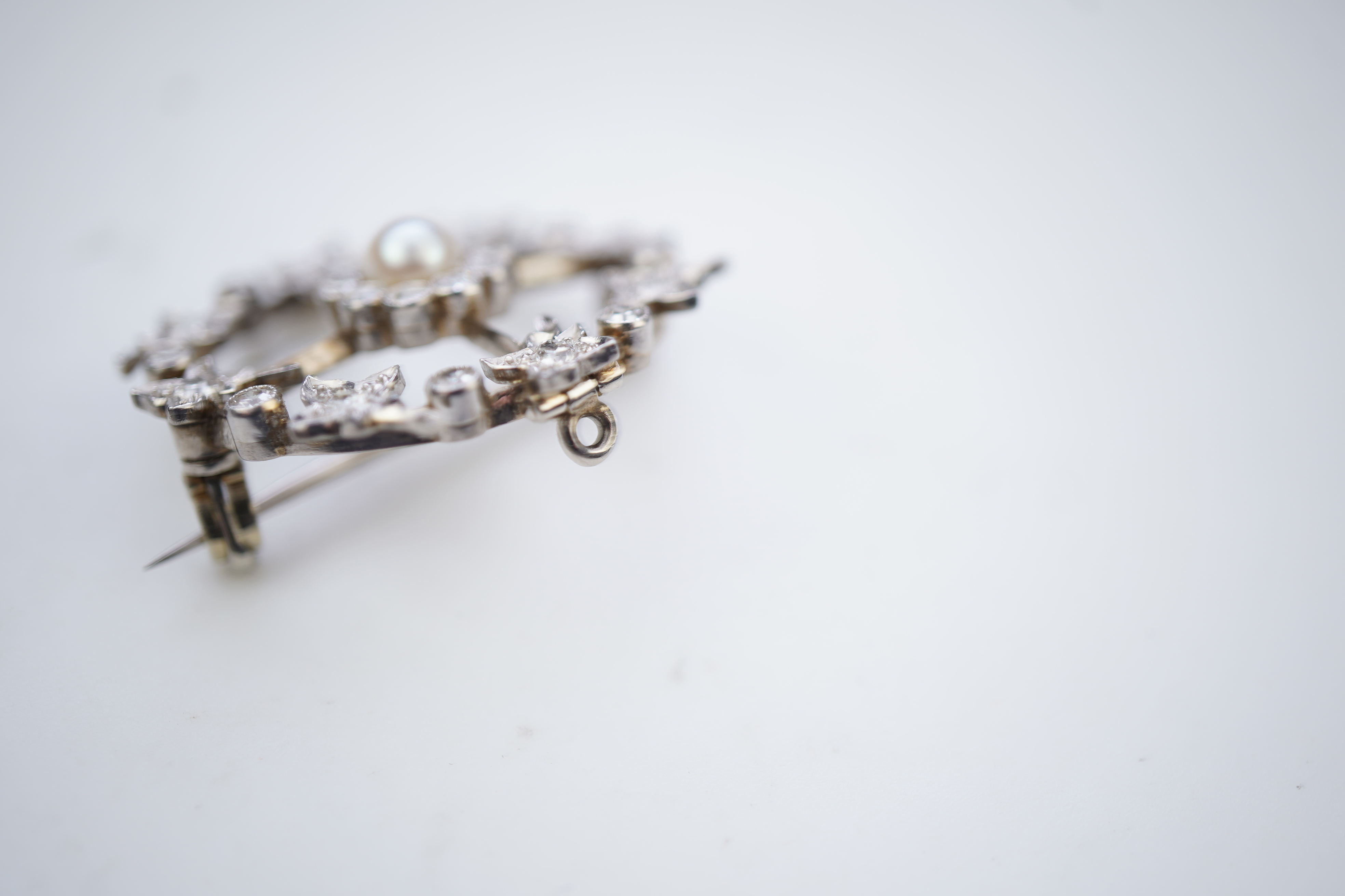 An attractive Edwardian pearl and diamond brooch, circa 1910